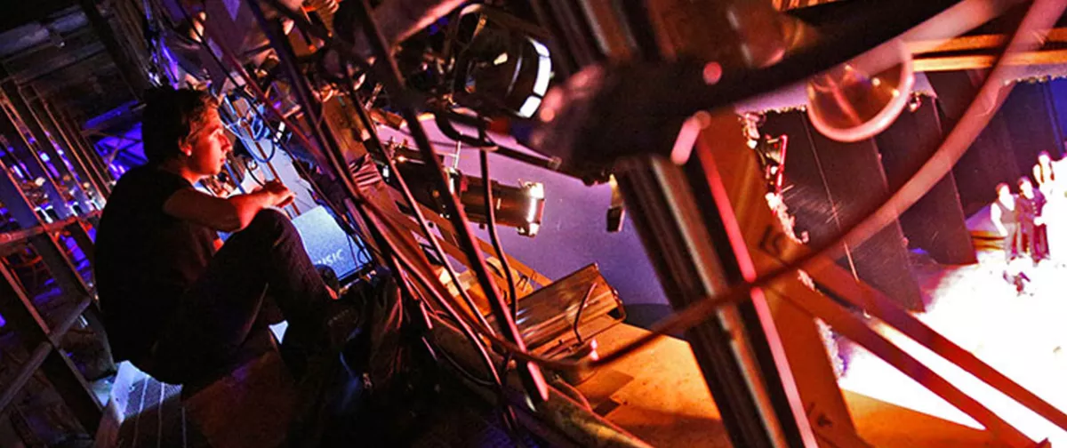 A student focuses lights for a theatre production at SUNY Oneonta