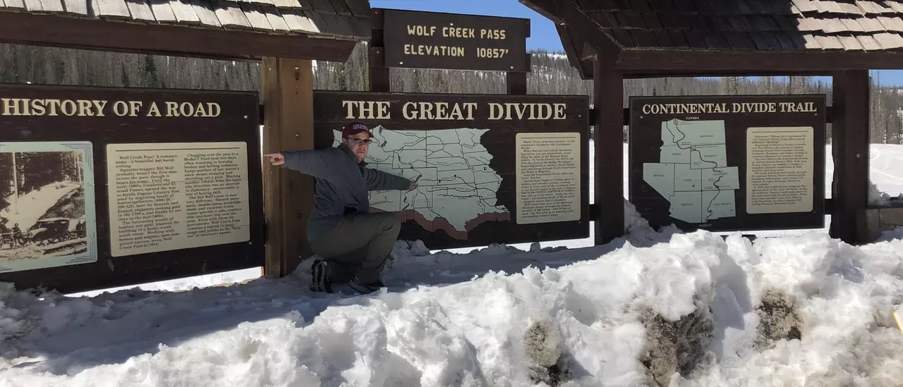 Dr. Chris Karmosky explains drainage patterns at the continental divide Faculty & Staff Dr. Chris Karmosky