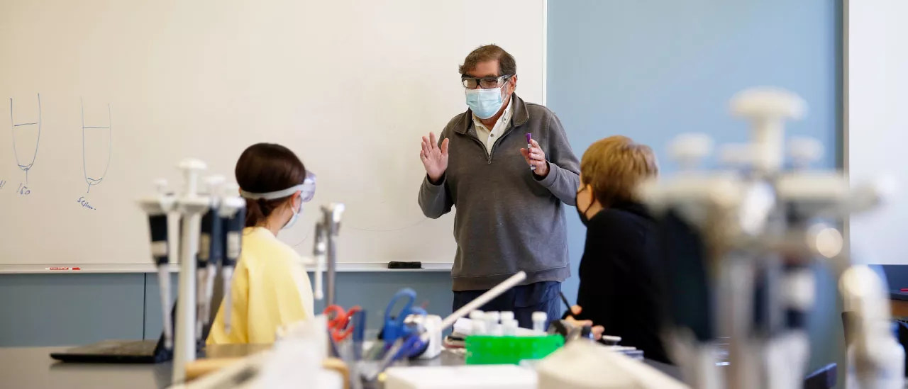 Professor working with students
