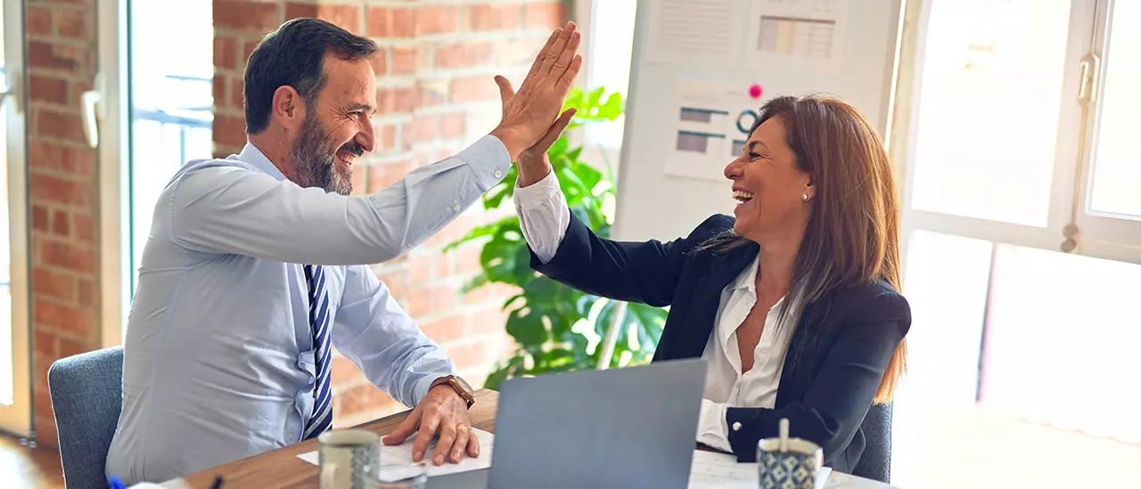 Colleagues "high-fiving" eachother