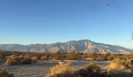 Mountains in a dessert with blue sky.