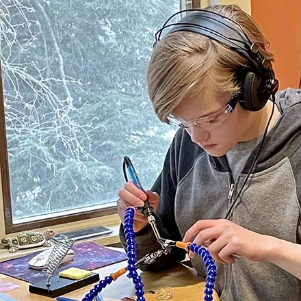 Go STEM student soldering