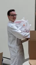 iGEM Team members unpacking materials donated from Corning