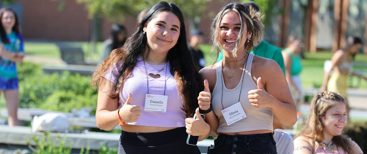 Two girls enjoying orientation activities.