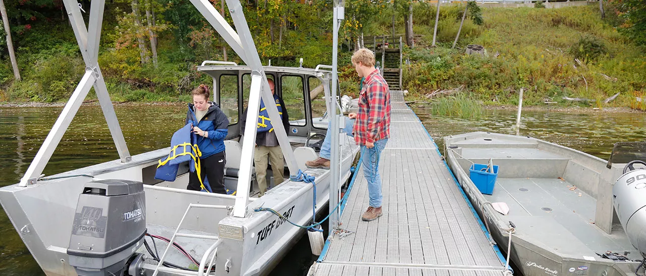 Lake Management students preparing to go out on a lake on a boat.