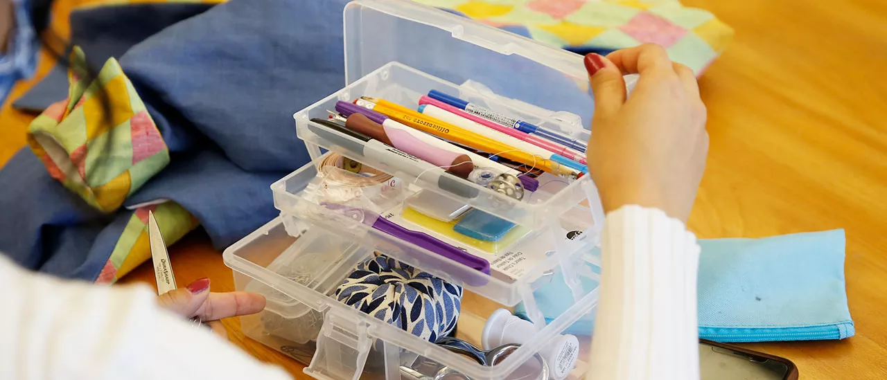 Various fashion supplies in a storage container.