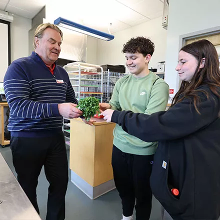 Collen Engle showing highshool students foods