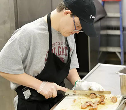 Pathfinder Village students assist in the dining halls