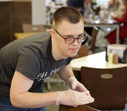 Pathfinder Village students assist in the dining halls