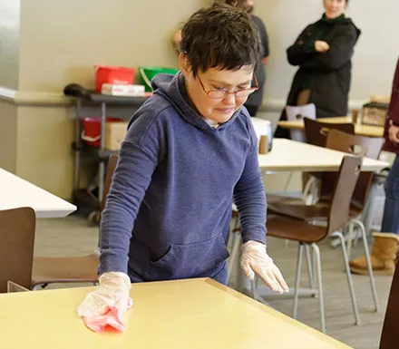 Pathfinder Village students assist in the dining halls