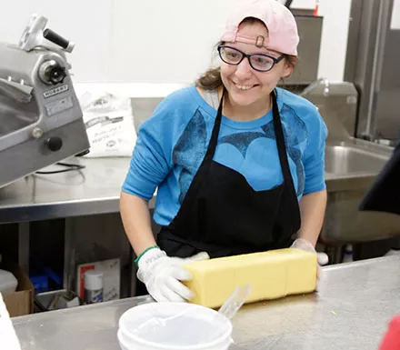 Pathfinder Village students assist in the dining halls