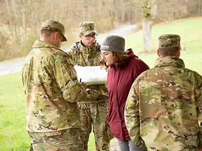 soldiers and students engaged in an exercise that took them out of a classroom