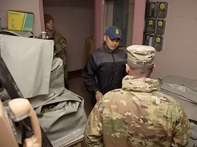 soldiers and students engaged in an exercise that took them out of a classroom