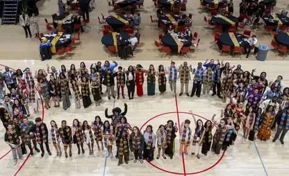 Students participate in the Kente Graduation Celebration.