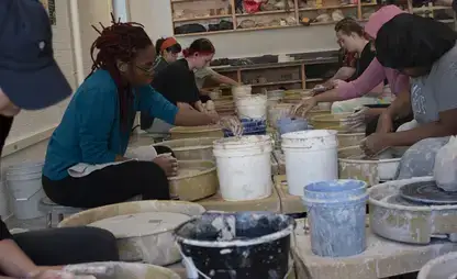 Students take part in a wheel throwing class and glazing demonstration.