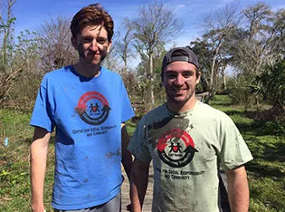 Students covered in mud in New Orleans.