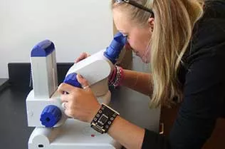 Student using a microscope.