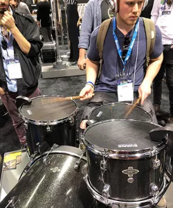 Oneonta student Jonah Cohn tries out a drumkitdrum kit