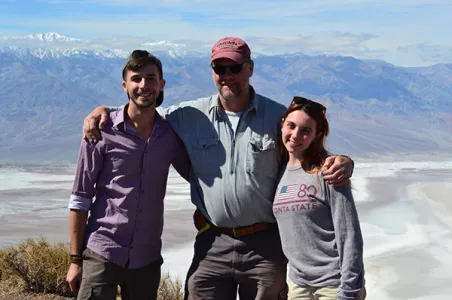 Students and faculty posing in front of the Bad Lands