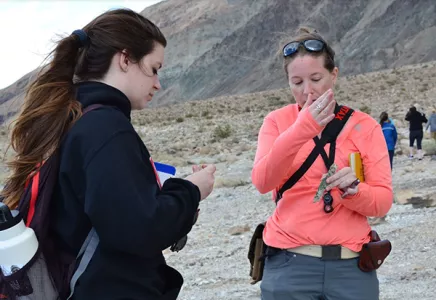 Students sharing a snack in the Bad Lands