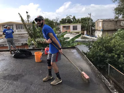 Student volunteers fixing a roof in Puerto Rico.