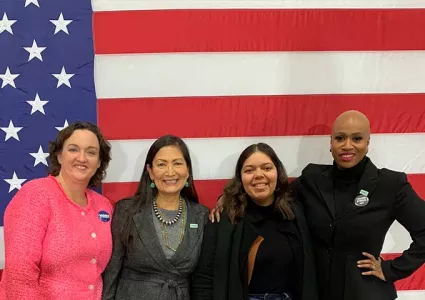 Candidates in front of flag