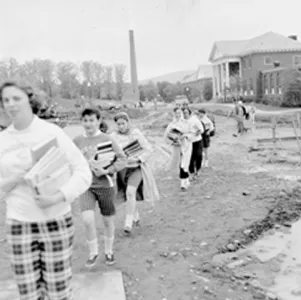 Carrying books across an uncompleted jobsite